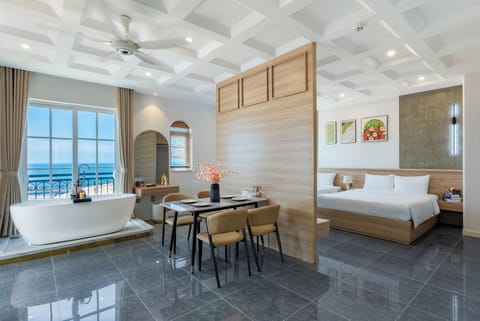 Deluxe Quadruple Room, Balcony, Beach View | Desk, laptop workspace, soundproofing, free WiFi