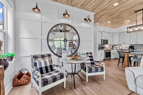 1st Floor – Great Room with comfortable lounge seating and a 4K Smart TV. Perfect for relaxing after a beach day, family movie nights, or gathering together during your Miramar Beach vacation.