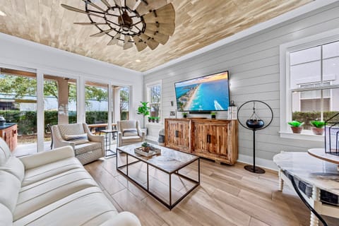 1st Floor – Great Room with comfortable lounge seating and a 4K Smart TV. Perfect for relaxing after a beach day, family movie nights, or gathering together during your Miramar Beach vacation.