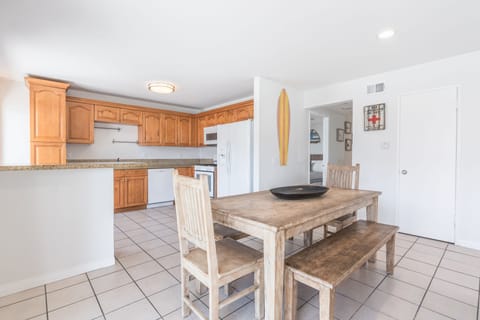 The kitchen opens out to the dining area, making meal prep a social affair