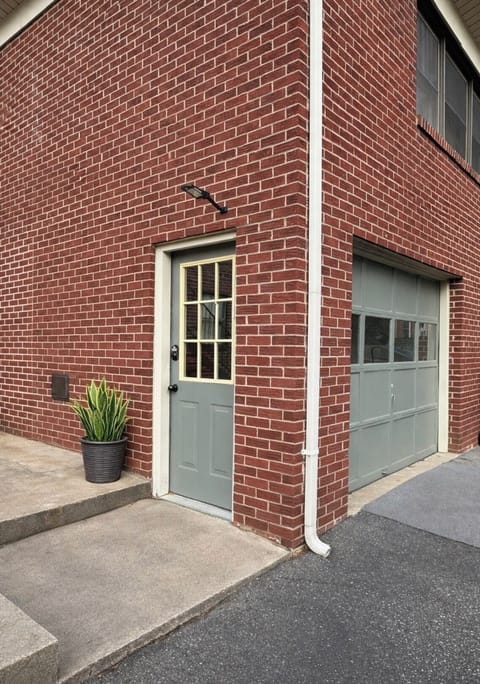 Owners entrance to separate basement storage area for equipment.