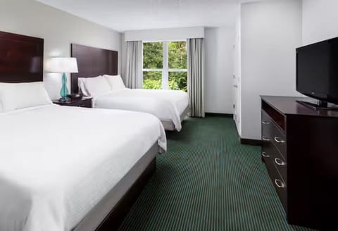 Sink into two plush beds after a day of exploring.