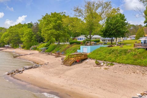 Deck life hits different here. Cottage views, sandy toes, and plenty of room to lounge or play—this is the good stuff.