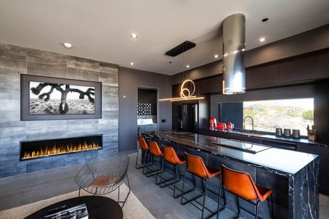 Fireplace and breakfast bar.