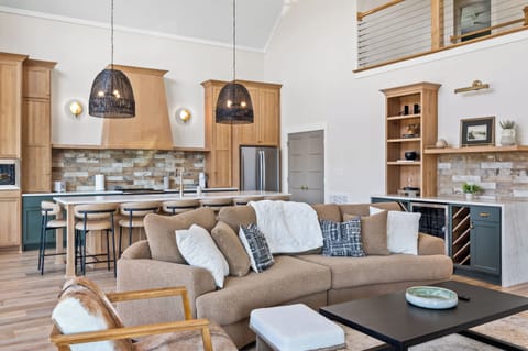 Living Room 1: Imagine cozy evenings spent on this plush sofa, surrounded by natural light and elegant design. This living room is the heart of your home away from home.