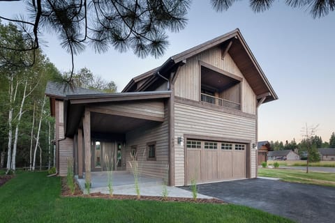 Arrive to a modern timber retreat with easy driveway access.