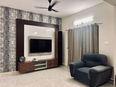 Luxury Apartment, Balcony | Living area | Flat-screen TV, printers