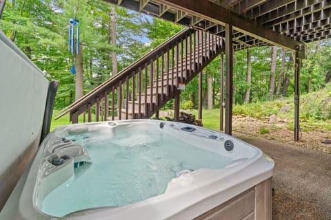 Unwind in your private hot tub surrounded by lush forest views, where bubbling jets melt away stress beneath towering trees.