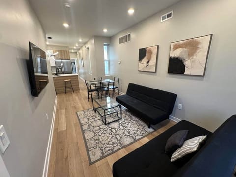 Living room with everything you need for a relaxing stay: a flat-screen TV with Roku channels and high-speed WiFi. Additionally, our living room is equipped with two comfortable sofa beds for extra guests or a cozy night in.