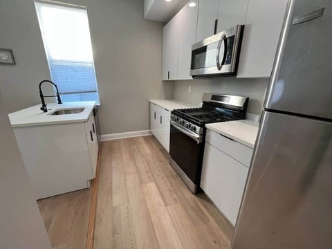 Big new kitchen with breakfast bar, dishwasher , oven/range , microwave, garbage disposal, stainless refrigerator.