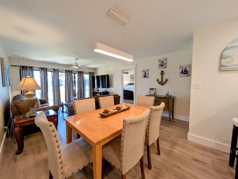 Spacious dining and living area with coastal charm