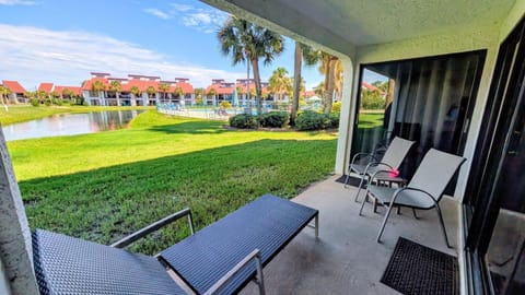 Ground floor patio with lake and pool views.