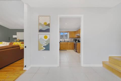 The entryway allows access to the full kitchen, living room, or bedrooms on the right