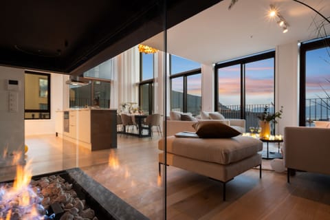 Luxury Duplex, Ocean View | Living area | Flat-screen TV