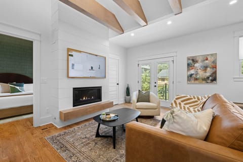 Cozy up by the gas fireplace with a movie on the Smart TV.