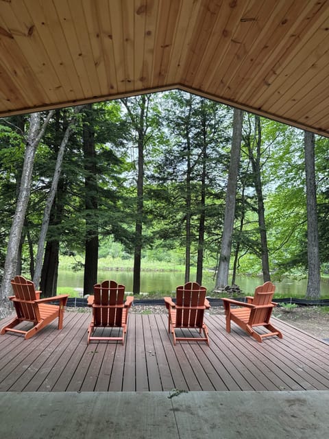 Covered porch and deck overlooking the Muskegon River.