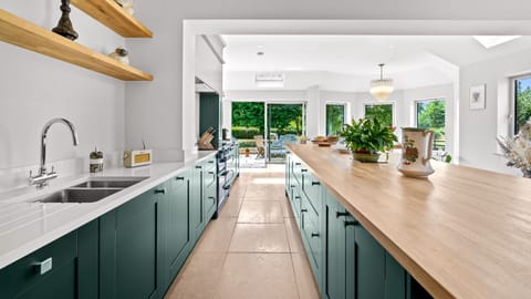 Elegant yet practical, it's a kitchen designed for feasts, chatter, and everyday ease.