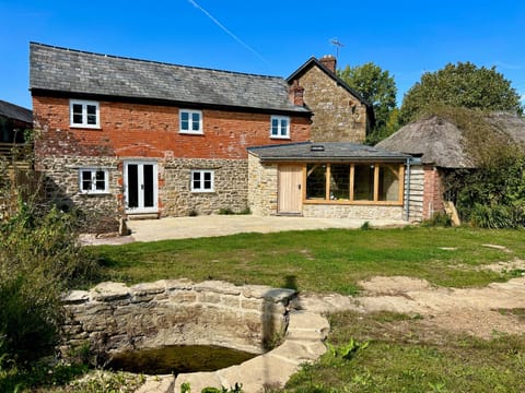 The Terrace outside is a real suntrap with the stream running in front of it