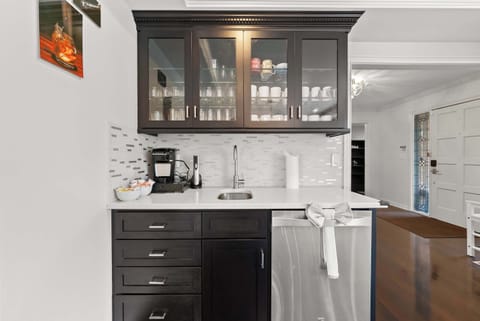 The dining room’s wet bar is ideal for whipping up after dinner coffee & cocktails​