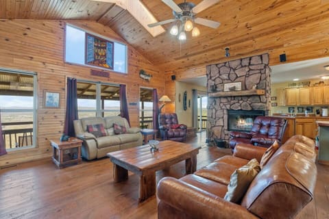 Massive windows fill the space with natural light and frame breathtaking views of the river and valley below. A unique stained glass detail adds charm to this beautifully crafted space—truly a place to relax and take it all in. ☀️✨