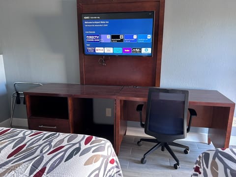 Desk, laptop workspace, blackout drapes, iron/ironing board