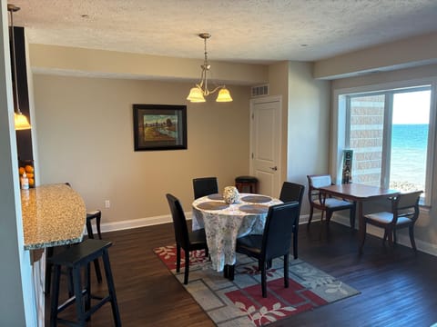Spacious open concept condo with lake view from kitchen, dining room and living 