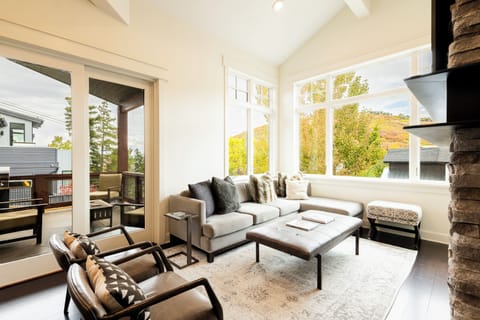 Main Living Level - Modern furnishings with TV, Gas Fireplace, and access to deck.