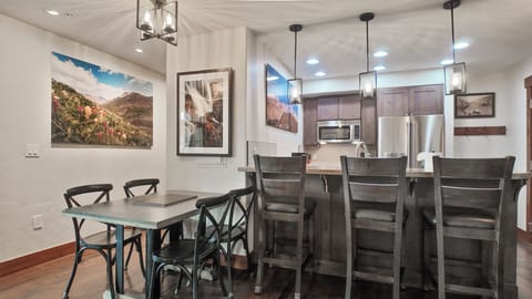 Kitchen with breakfast bar and dining table