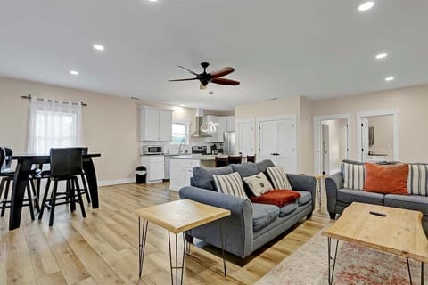 Cozy up in the inviting living room featuring a plush sofa, loveseat, and smart TV.