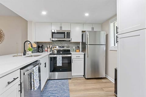 Bright white cabinets keep the space feeling fresh and open.