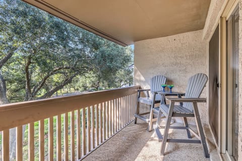 Private balcony with two chairs overlooking luscious Lowcountry greenery for ultimate relaxation