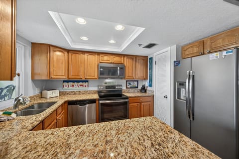 Fully stocked kitchen w/ stainless appliances, granite counters & plenty of prep space.