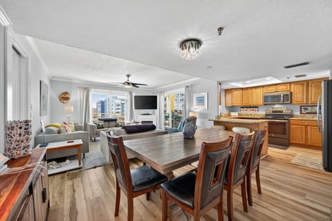 Open dining area flows into the kitchen, ideal for shared meals & easy conversation.