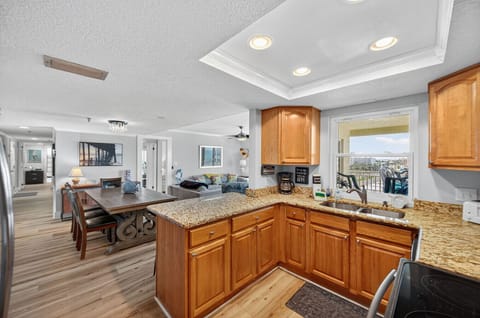 Kitchen opens to the dining area, making meals & gatherings easy and social.