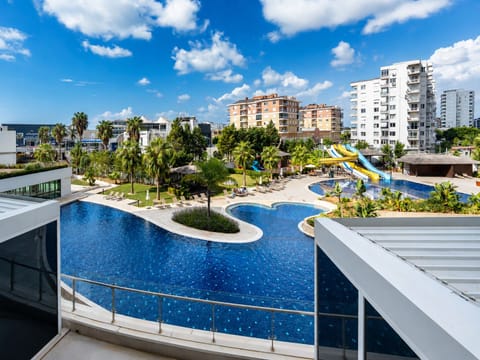 Luxury Condo, 1 Queen Bed with Sofa bed, Balcony, Pool View | Living area | 32-inch Smart TV with satellite channels