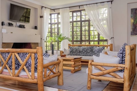 Family Bungalow, Garden View | Living area | 32-inch Smart TV with digital channels