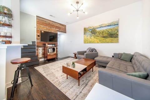 A cozy relaxing living room to wind down in. Has a single seat bar space.