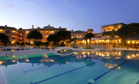 Seasonal outdoor pool, open 10:00 AM to 7:00 PM, pool umbrellas