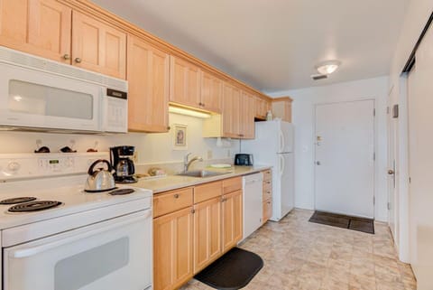 This kitchen offers modern appliances and ample storage, providing convenience for preparing meals during your stay.
