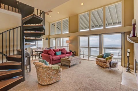 Experience breathtaking panoramic ocean views from the spacious living room, complete with a dining area and a balcony, all adjoining a fully equipped kitchen.