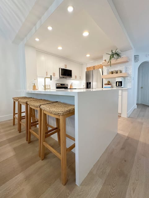 Kitchen island with bar seating for relaxed meals and gathering.