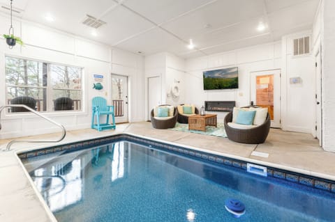 Your private indoor pool heated to 84° with fireplace, big‑screen HD Smart TV and Xfinity Stream - just outside the door is a private balcony with hot tub.