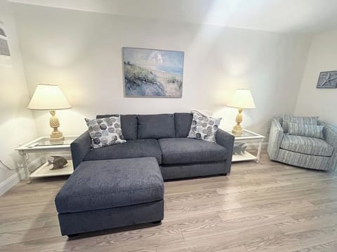 A comfortable living room, including a cozy sleeper sofa bed.