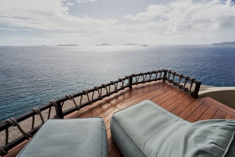 Unwind on the private stargazing deck, where comfortable loungers offer breathtaking 360° views of the ocean and nearby islands.
