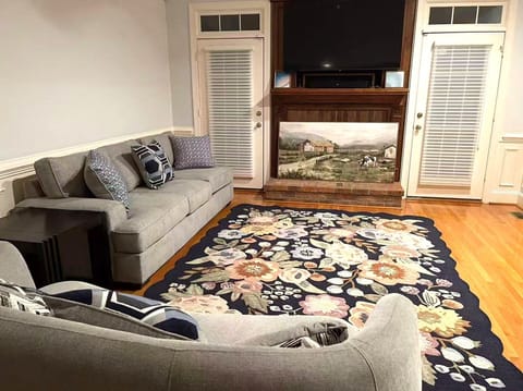 Stylish living room with fireplace and mounted flat-screen TV