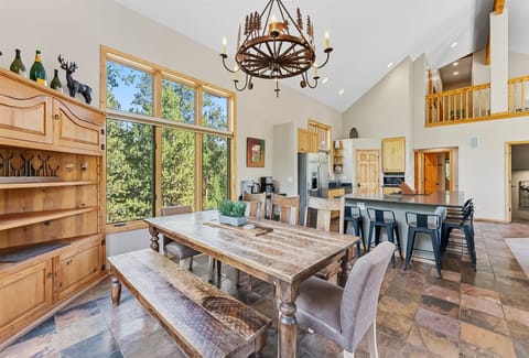 
Dining area (main floor): 8-person dining table, island seating for 9