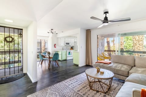 Open layout with cozy living area, dining space, and kitchen access.