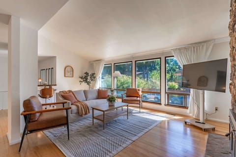 Enjoy abundant natural light through expansive windows and a cozy, open layout living room perfect for relaxing or entertaining.