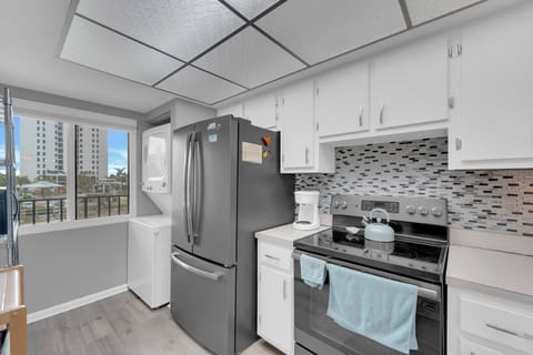 Washer and dryer in the unit next to the fridge