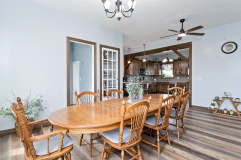Inviting dining area with rustic charm, seamlessly connected to the kitchen, ideal for entertaining and creating lasting memories.